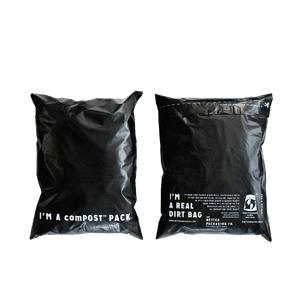 Front and back of black Better Packaging compostable mailers on a transparent background